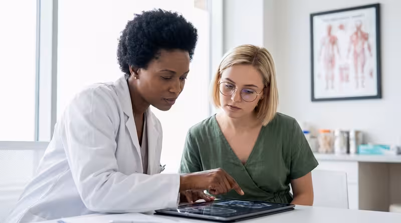 Doctor and patient consultation for Book Your Microsuction Ear Wax Removal Appointment Today, And Ease the Discomfort of Ear...